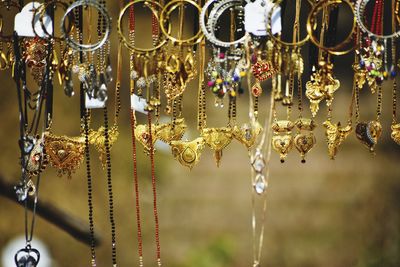 Close-up of decorations hanging in store for sale