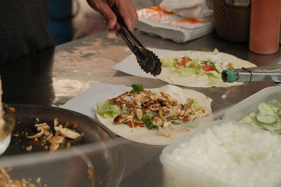 Midsection of man preparing food