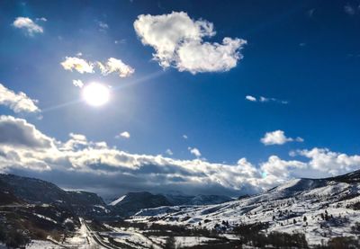 Scenic view of snowcapped mountains against sky