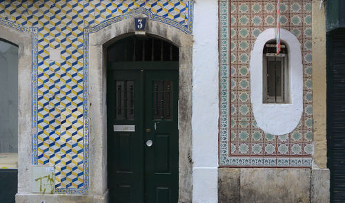 Exterior facade covered with traditional portuguese tiles on a historic building in lisbon, portugal