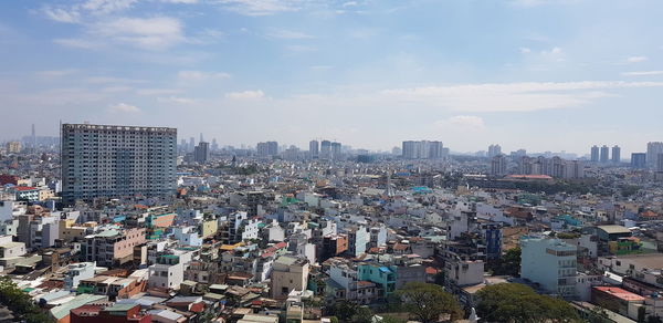 High angle view of buildings in city against sky