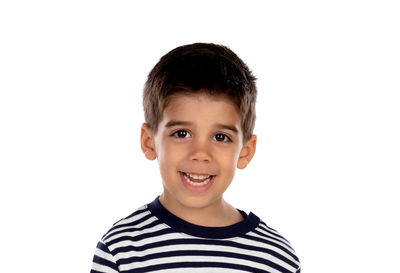 Portrait of smiling boy against white background