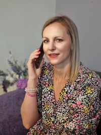 Portrait of beautiful woman smiling and using smartphone 