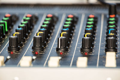 Close-up of sound mixer at recording studio