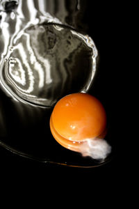 Close-up of orange over white background
