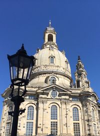 Low angle view of building against clear blue sky