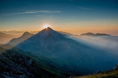 Scenic view of mountains against sky during sunset