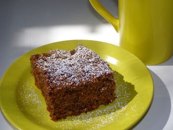 Chocolate cake with powdered sugar on plate