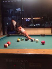 Cropped hand playing pool