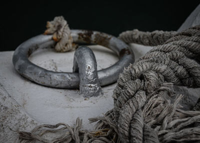 Close-up of rope tied on rusty metal