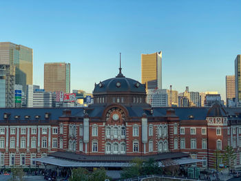 Buildings in city against sky