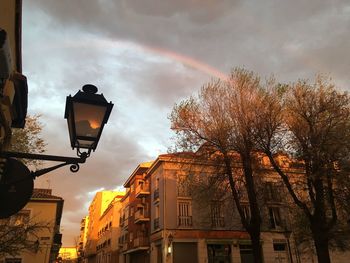 Rainbow. low angle view of street light against sky