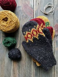 Mitten and wools on table