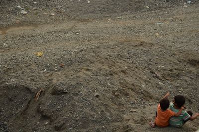 High angle view of father and son on floor