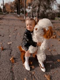 Portrait of happy boy standing outdoors