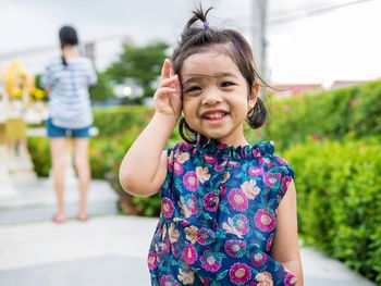 Portrait of cute smiling girl at park