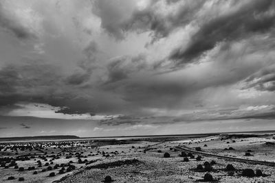 Scenic view of sea against cloudy sky