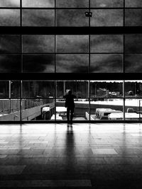 Man waiting at railroad station in city