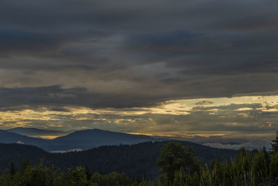 Scenic view of mountains against sky during sunset