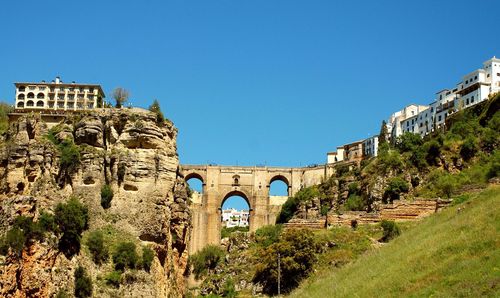 Arch bridge against blue sky