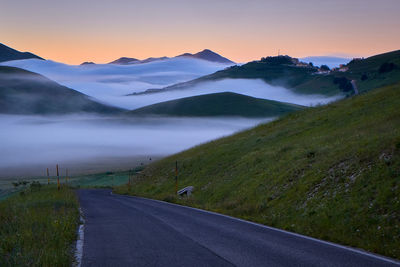 Scenic view of mountains against sky during sunset