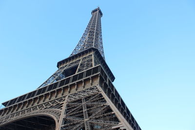 Low angle view of tower against blue sky