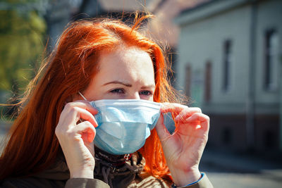 Portrait of young woman drinking ice cream
