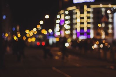 Defocused image of illuminated city at night