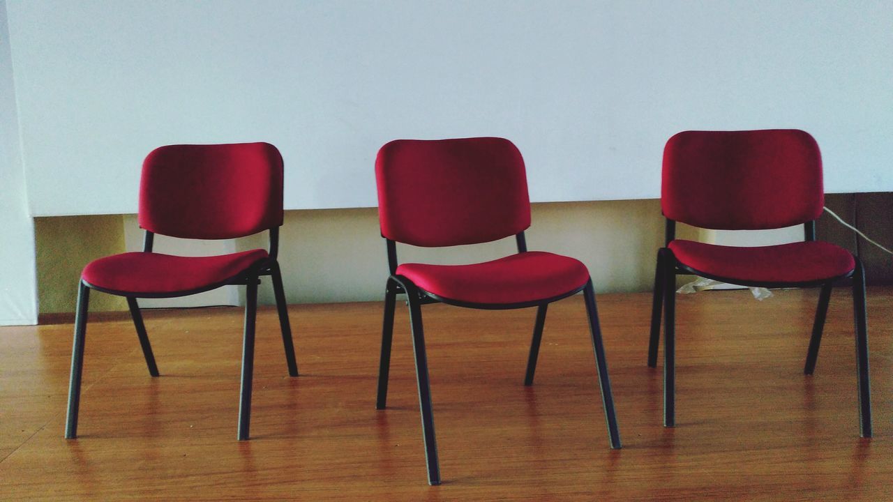 chair, empty, absence, indoors, table, seat, furniture, in a row, still life, side by side, arrangement, red, order, group of objects, no people, place setting, arranged, large group of objects, day, repetition