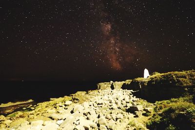 Scenic view of sea against sky at night