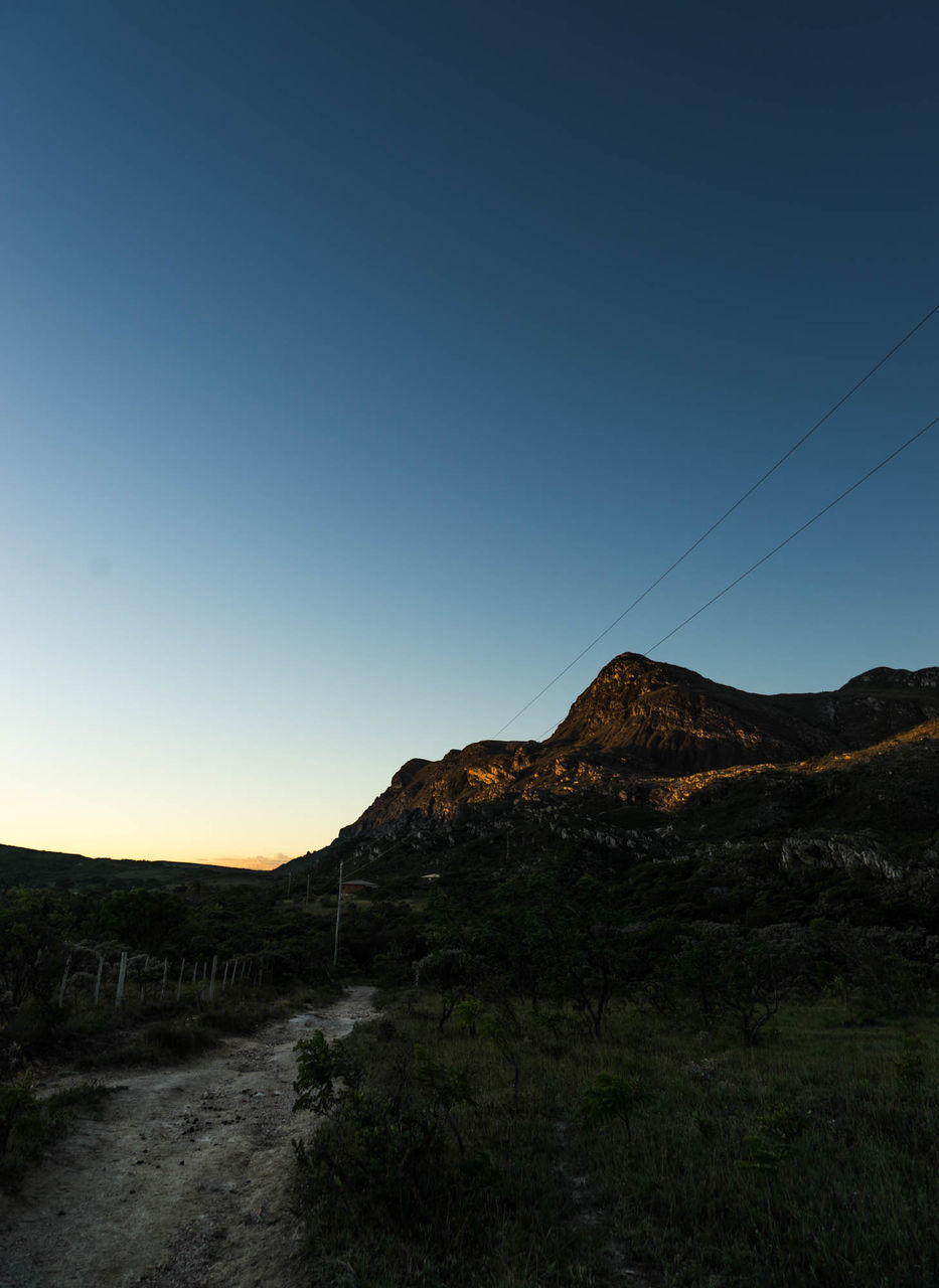 SCENIC VIEW OF LAND AGAINST CLEAR BLUE SKY