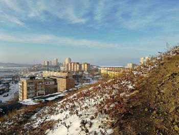 High angle view of buildings against sky during winter