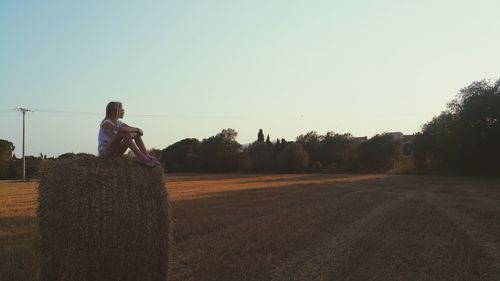 Man on field against sky