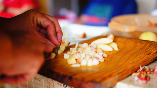 Cropped hand preparing food