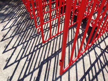 High angle view of red shadow on brick wall