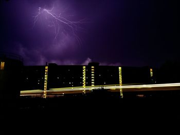 Light trails against sky at night