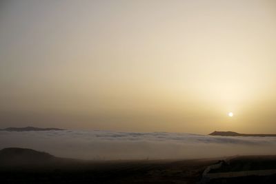 Scenic view of landscape against sky during sunset