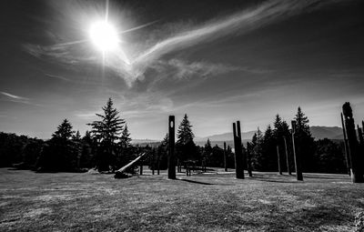 Trees on field against sky