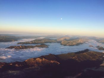 Aerial view of landscape against blue sky