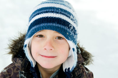 Portrait of smiling woman in snow