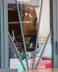 Close-up of books on table by window