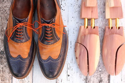 Directly above view of leather shoes on floorboard