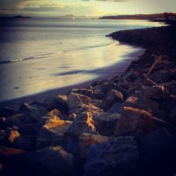 Scenic view of sea at sunset