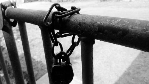 Close-up of a padlock hanging on railing