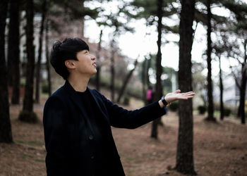 Man standing in forest