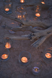 High angle view of illuminated candles