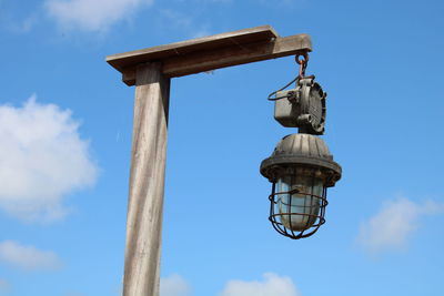 Low angle view of street light against sky