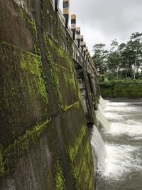 Scenic view of canal against wall