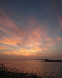 Scenic view of sea against sky at sunset