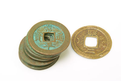 Close-up of coins on white background